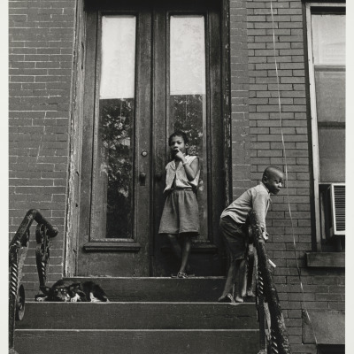 [Children and dog on stoop]