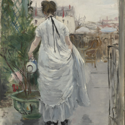 Young Woman Watering a Shrub